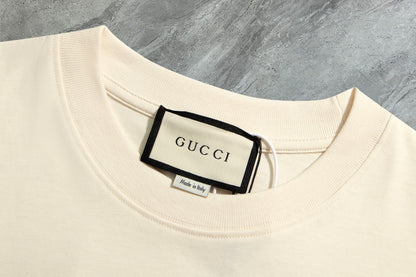 Gucci - T-shirt Gucci avec logo en bleu et motif - Crème