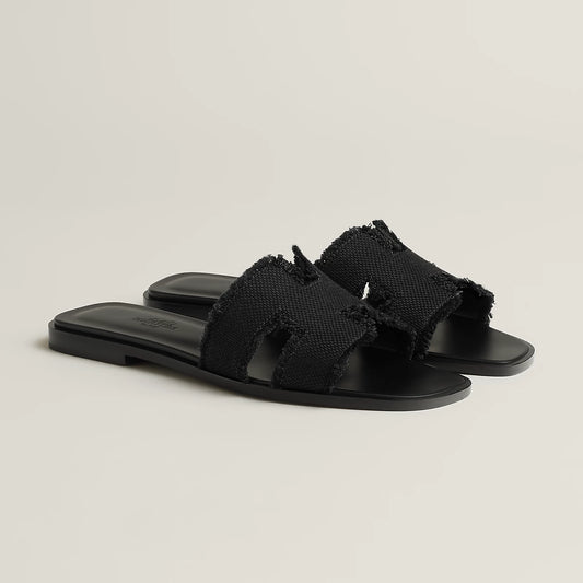 Hermès - Sandales Oran Noir en toile H effrangée